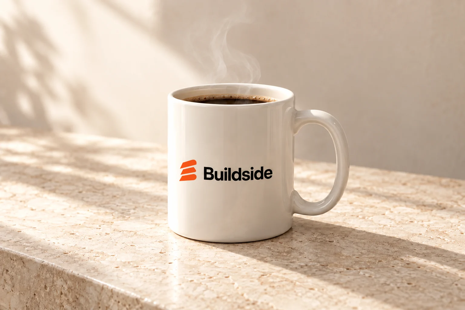 Warm-white Buildside mug with an orange and black logo
