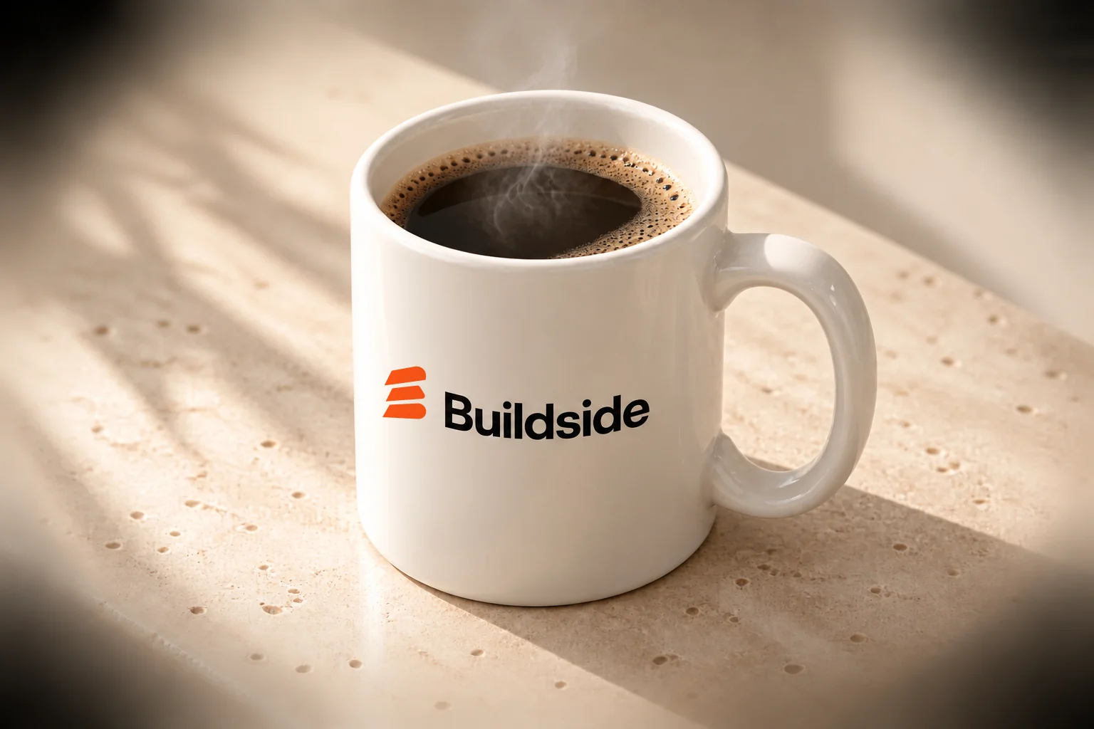 Close-up of the warm-white mug and Buildside logo