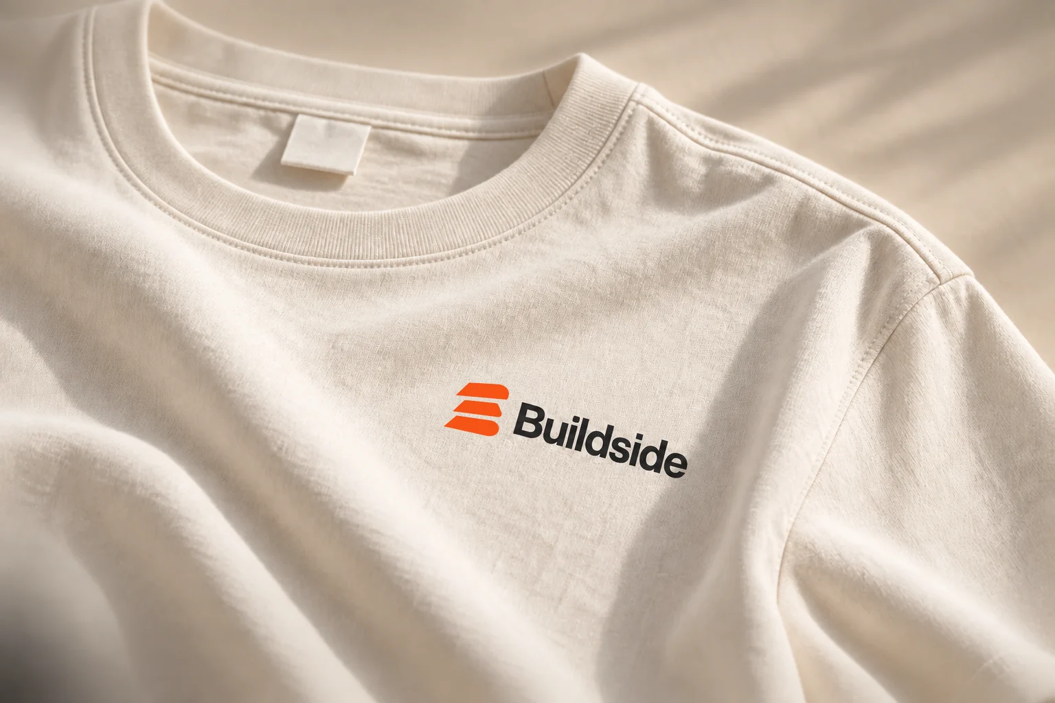 A close look at the natural tee and its small Buildside mark